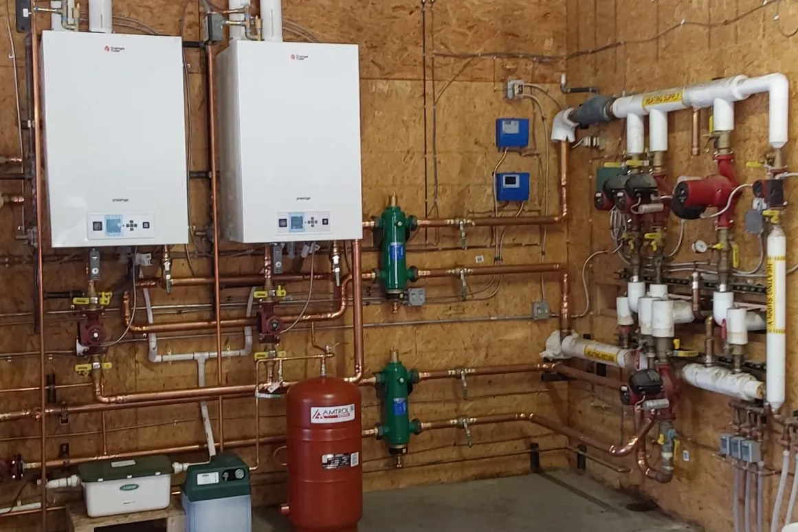 Two Triangle Tube Prestige Solo 399 boilers installed for commercial space heating in Granby Colorado