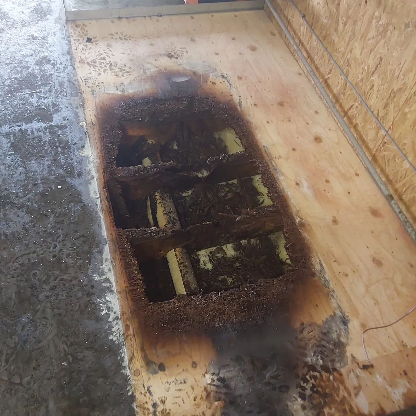 Scorched mechanical room floor caused by an overworked commercial boiler in Granby Colorado