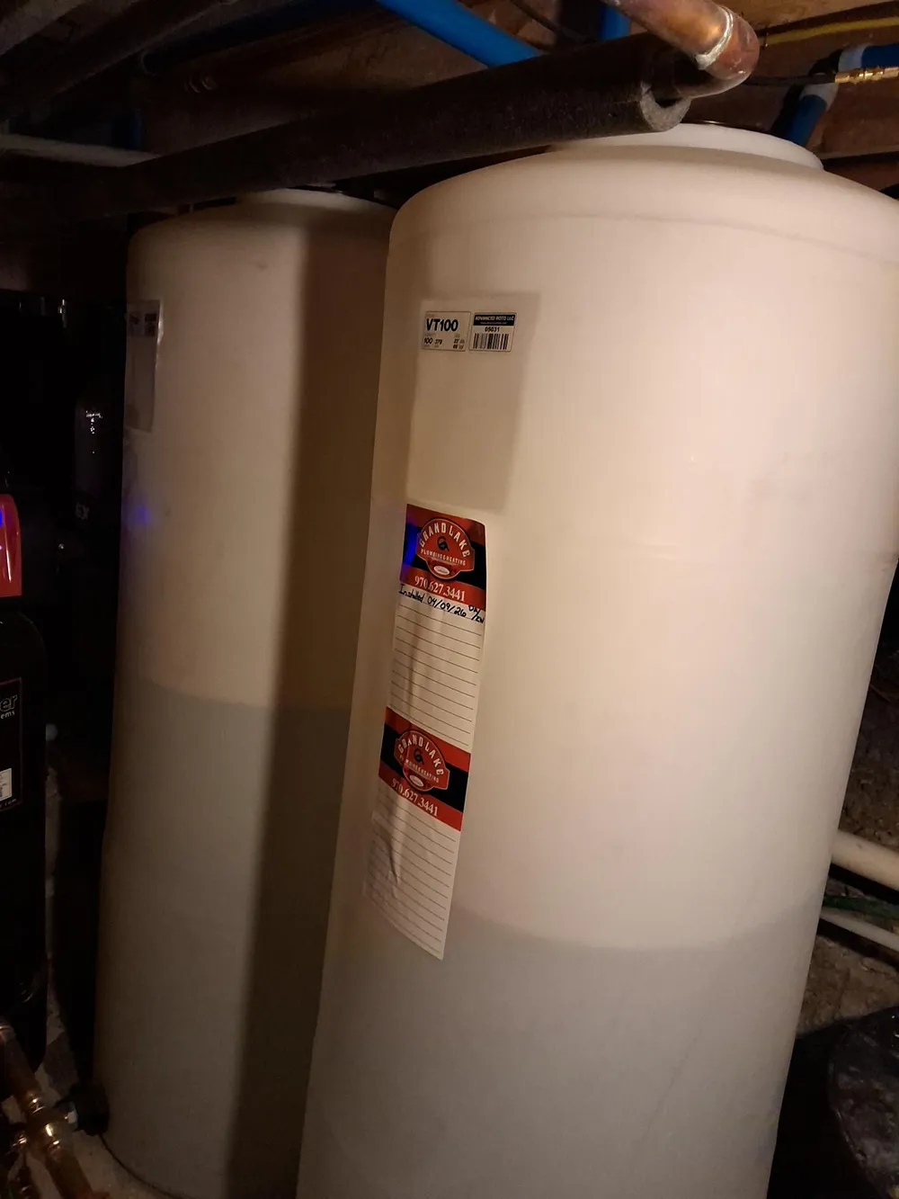 Two 100 gallon cistern tanks installed for treated well water storage in Kremmling Colorado