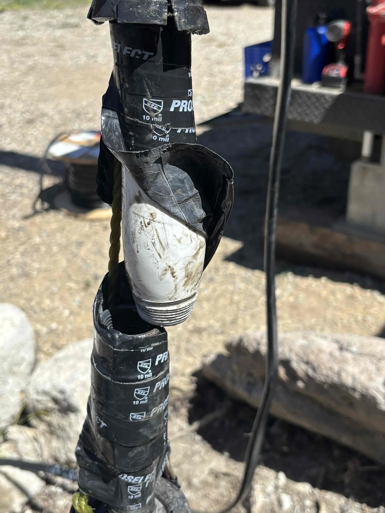 Recovered drop pipe and coupling from the old well pump assembly in Kremmling, Colorado